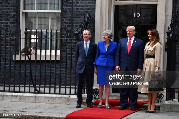 Prime Minister Theresa May and husband Philip May welcome US President Donald Trump and First Lady Melania Trump to 10 Downing Street as Larry the...