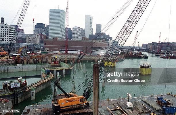 At Fort Point Channel, a concrete section is towed and sunk overnight.