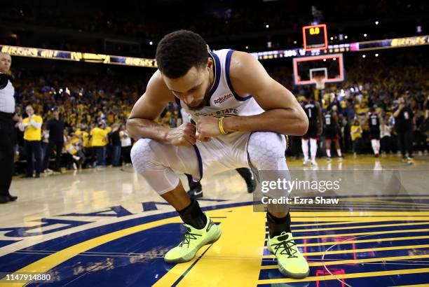 Stephen Curry of the Golden State Warriors reacts after they beat the Houston Rockets in Game Five of the Western Conference Semifinals of the 2019...