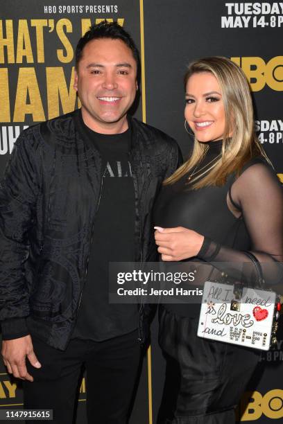 Oscar De La Hoya and Millie Corretjer attend Premiere of HBO's 'What's My Name: Muhammad Ali' at Regal Cinemas L.A. LIVE Stadium 14 on May 08, 2019...