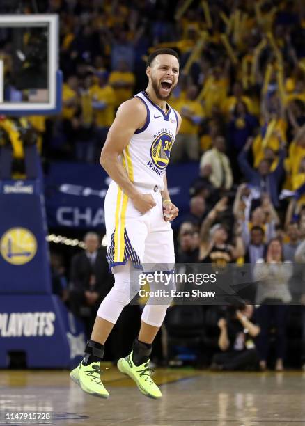 Stephen Curry of the Golden State Warriors reacts after Klay Thompson made the clinching basket with four second left of their game against the...