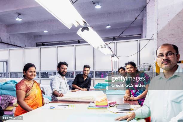 group of factory workers at the packaging area - indian shopkeeper stock pictures, royalty-free photos & images