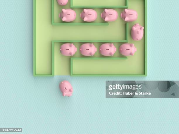 piggy bank leaving  a maze - piggy bank and maze stock pictures, royalty-free photos & images