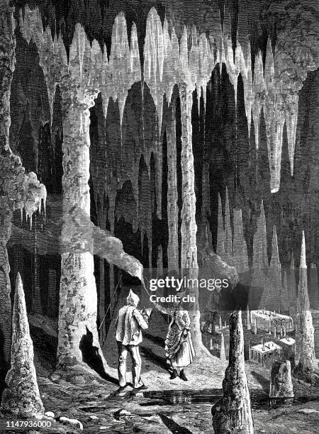 stalactite cave in hasel , fürstengruft, germany, black forest - cave stock illustrations