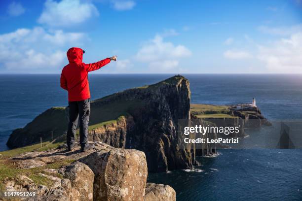 solo traveler in scotland - isle of skye - rocky point stock pictures, royalty-free photos & images