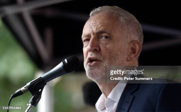 Leader of the Labour Party Jeremy Corbyn speaks to protesters during a demonstration outside the Houses of Parliament on the second day of U.S....