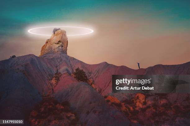 drone light painting around stunning rock formation at dusk. - 悪地地形 ストックフォトと画像