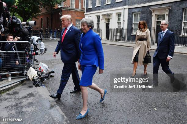 President Donald Trump, Prime Minister Theresa May, her husband Philip May and First Lady Melania Trump leave 10 Downing Street, during the second...