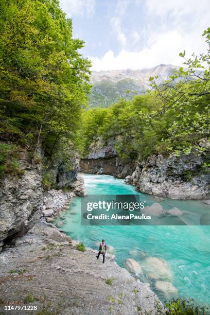 man admiring river soca canyon valley between kobard and bovec, julian alps, slovenia, europe - triglav slovenia stock pictures, royalty-free photos & images