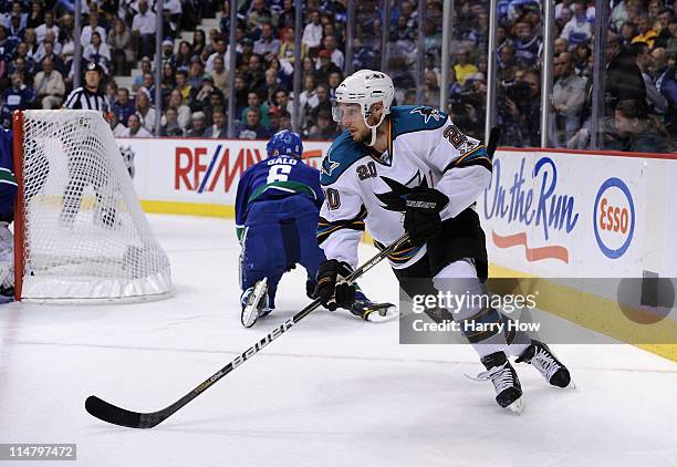 Kyle Wellwood of the San Jose Sharks skates around the net in Game Five of the Western Conference Finals against the Vancouver Canucks during the...