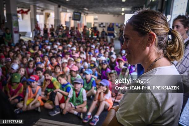 French footballer Camille Abily meet with pupils on June 4, 2019 at the Charles de Rochefoucauld school in Lyon.