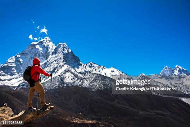 appreciating the view of himalayas. - nepal man stock pictures, royalty-free photos & images