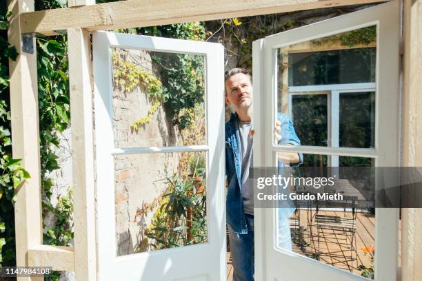 man checking doors in diy project. - window fitting eco stock pictures, royalty-free photos & images