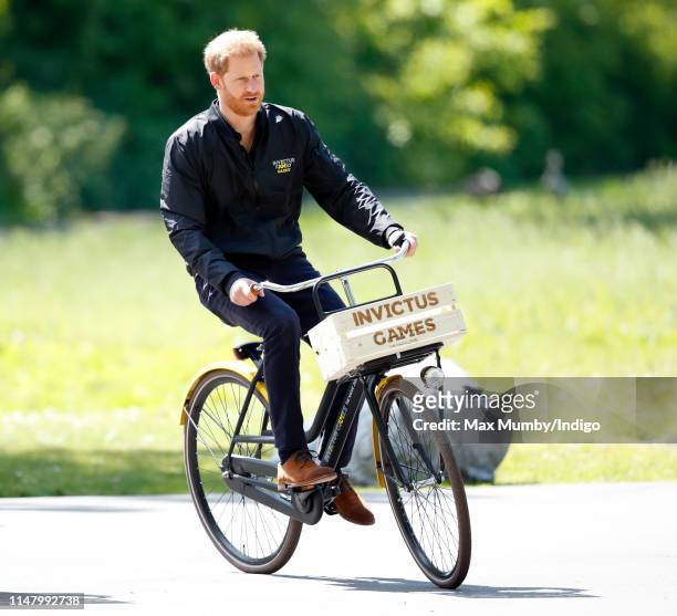 Prince Harry, Duke of Sussex rides a bicycle around Sportcampus Zuiderpark as part of a programme of events to mark the official launch of the...