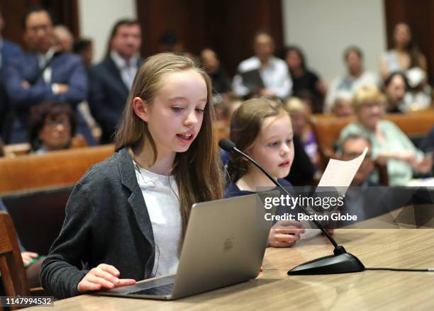 Lorelei Currier left, of Boston, and her sister Brigitte Currier speaks during a hearing for bills that would require schools to have allergy action...