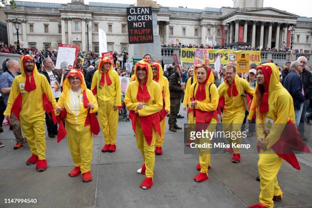 Chlorinated chicken dancers in Trafalgar Square during protests against the state visit of US President Donald Trump on 4th June 2019 in London,...