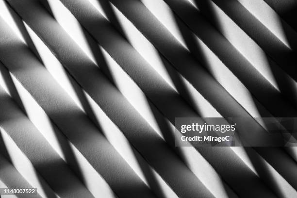 zigzag shaped light and shadow on paper - alto contraste imagens e fotografias de stock