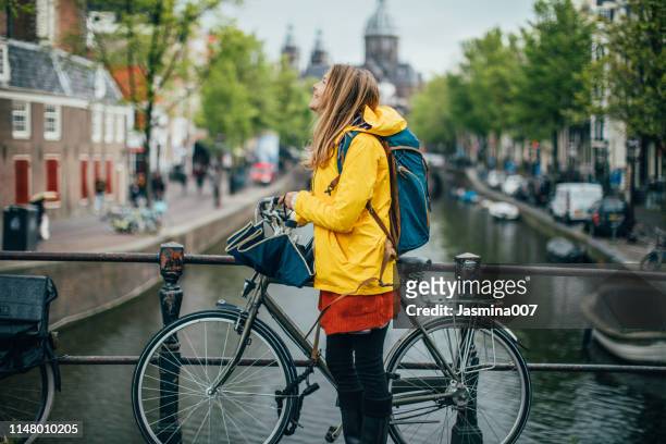 rainy and cold day in amsterdam - netherlands canal stock pictures, royalty-free photos & images