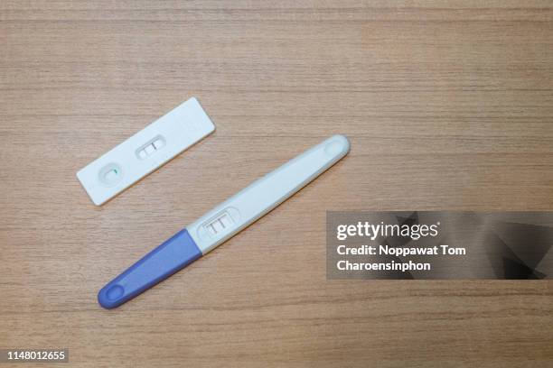 positive pregnancy test - pregnancy test stock pictures, royalty-free photos & images