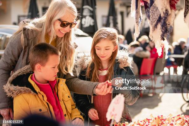 family exploring the street markets - craft market stock pictures, royalty-free photos & images