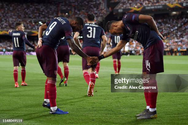 Pierre-Emerick Aubameyang of Arsenal celebrates after scoring his team's first goal with teammate Alexandre Lacazette during the UEFA Europa League...