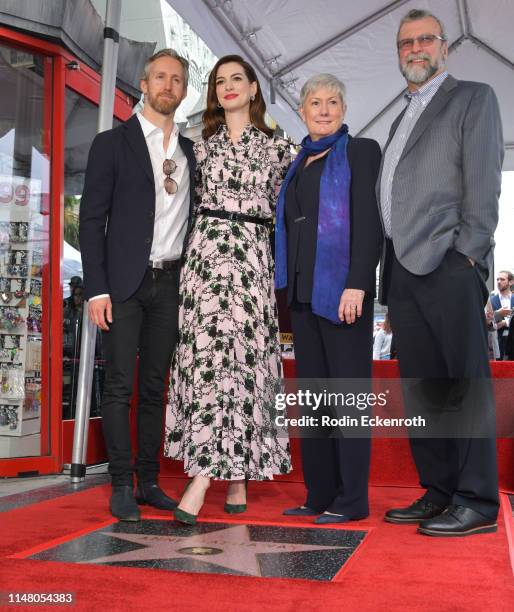 Adam Shulman, Anne Hathaway, Kate McCauley Hathaway and Richard Hathaway pose for portrait at Anne Hathaway Honored With Star On The Hollywood Walk...