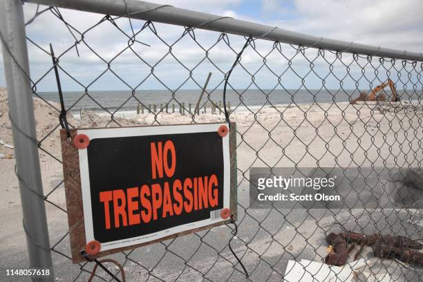 Fence surrounds a construction site as a building damaged by Hurricane Michael is rebuilt on May 09, 2019 in Mexico Beach, Florida. Seven months...