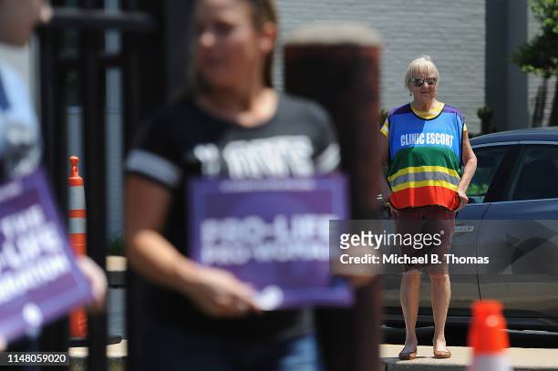Planned Parenthood clinic escort is seen during a pro-life rally outside the Planned Parenthood Reproductive Health Center on June 4, 2019 in St...