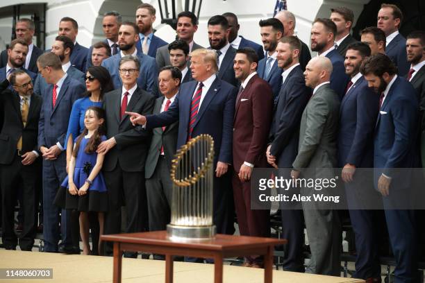 President Donald Trump poses for photos with members of the Boston Red Sox at the White House May 9, 2019 in Washington, DC. President Donald Trump...