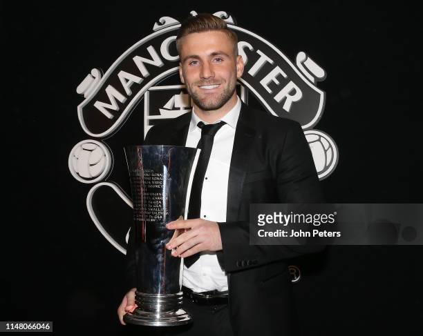 Luke Shaw of Manchester United poses with the Players' Player of the Year award at the club's annual Player of the Year awards at Old Trafford on May...