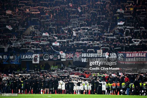 Eintracht Frankfurt players and staff stand in front of Eintracht Frankfurt fans as they show their support after the UEFA Europa League Semi Final...