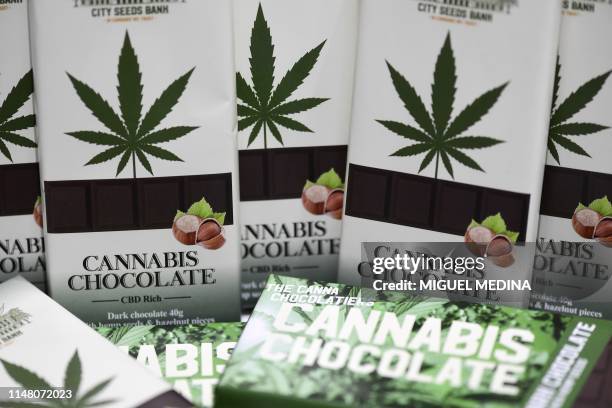 Picture taken on June 4, 2019 in Milan shows chocolate bars made with cannabis in a hemp store, central Milan. - Hemp is "legal" marijuana as the THC...