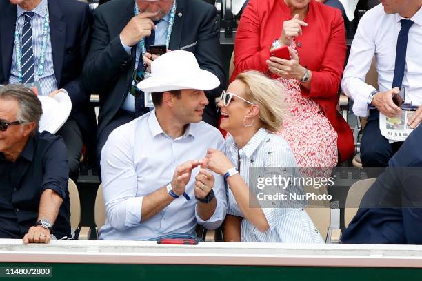 Elodie Gossuin, Bertrand Lacherie watch a game betwen Switzerlands' Roger Federer and Switzerland's Stanislas Wawrinka during their men's singles...