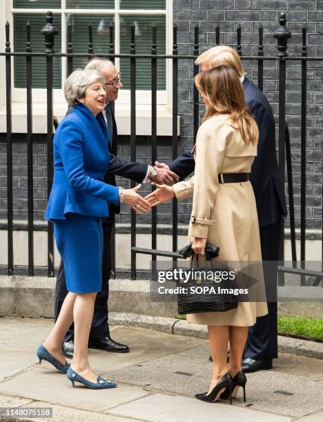 Prime Minister Theresa May and husband Philip May welcome US President Donald Trump and First Lady Melania Trump shake hands at 10 Downing street for...