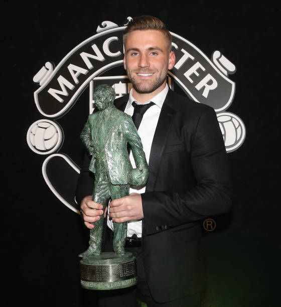 Luke Shaw of Manchester United poses with the Sir Matt Busby Fans' Player of the Year award at the club's annual Player of the Year awards at Old...