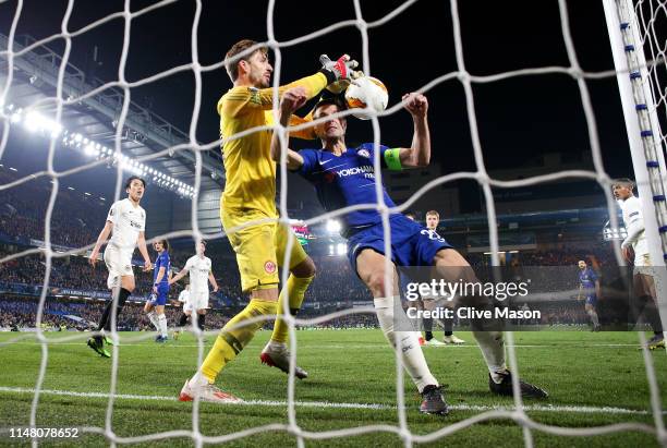 Cesar Azpilicueta of Chelsea and Kevin Trapp of Eintracht Frankfurt challenge for the ball on the goal line which leads to a disallowed goal for...