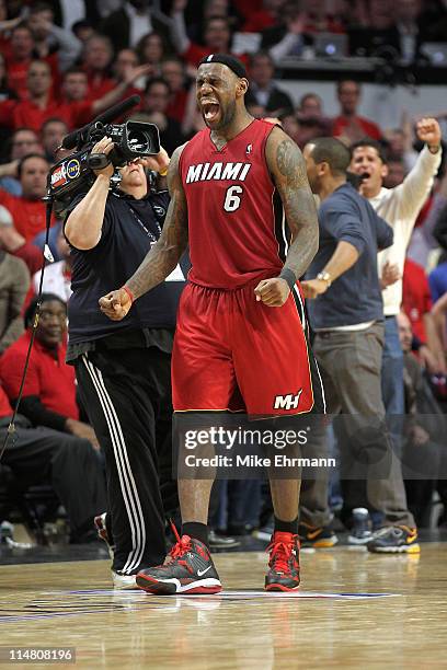 LeBron James of the Miami Heat celebrates after the Heat won 83-80 against the Chicago Bulls in Game Five of the Eastern Conference Finals during the...