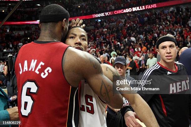 Derrick Rose of the Chicago Bulls looks on dejected as he congratulates LeBron James of the Miami Heat after the Heat won 83-80 in Game Five of the...