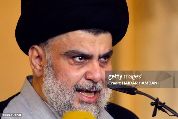 Iraqi Shiite cleric and political leader Moqtada al-Sadr delivers the Eid al-Fitr sermon during the Muslim holiday's morning prayer at the Grand...