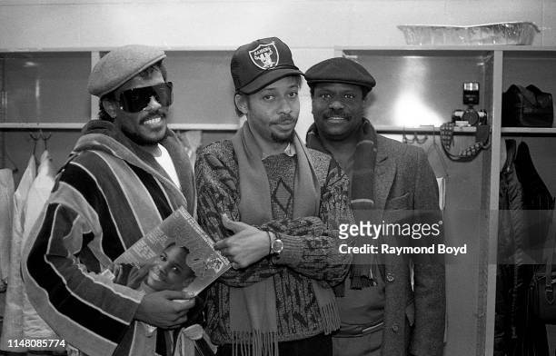 Singers and musicians Charlie Wilson, Robert Wilson and Ronnie Wilson from The Gap Band poses for photos backstage at the U.I.C. Pavilion in Chicago,...