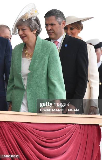 Britain's Prime Minister Theresa May and US First Lady Melania Trump attend an event to commemorate the 75th anniversary of the D-Day landings, in...