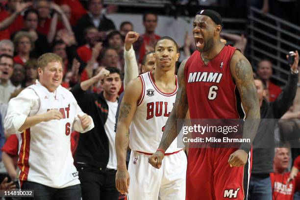 LeBron James of the Miami Heat celebrates after the Heat won 83-80 against Derrick Rose of the Chicago Bulls in Game Five of the Eastern Conference...