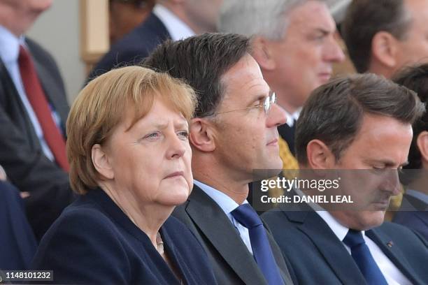 German Chancellor Angela Merkel, Dutch Prime Minister Mark Rutte and Luxembourg's Prime Minister Xavier Bettel attend an event to commemorate the...