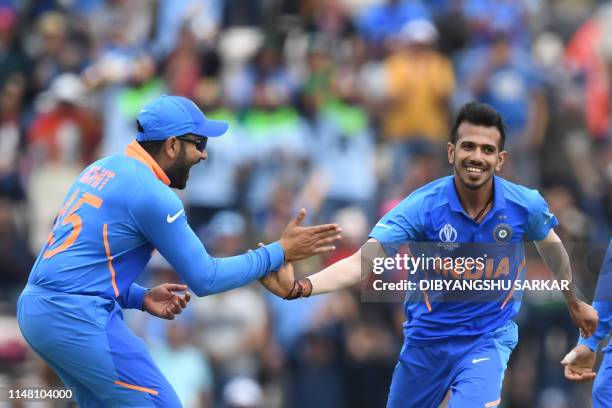 India's Yuzvendra Chahal celebrates with teammates after dismissing South Africa's Rassie van der Dussen for 22 during the 2019 Cricket World Cup...