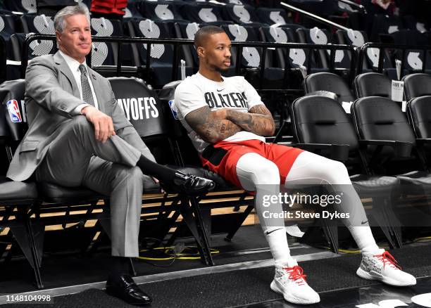 General Manager Neil Olshey of the Portland Trail Blazers sits with Damian Lillard during warmups before Game Six of the Western Conference...