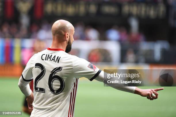 Laurent Ciman of Toronto FC points for a pass against Atlanta United during the game at Mercedes-Benz Stadium on May 08, 2019 in Atlanta, Georgia.