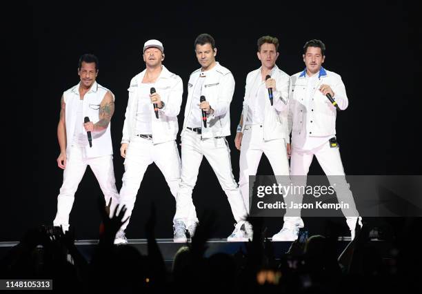 Danny Wood, Donnie Wahlberg, Jordan Knight, Joey McIntyre and Jonathan Knight of the musical group New Kids On The Block perform at Bridgestone Arena...