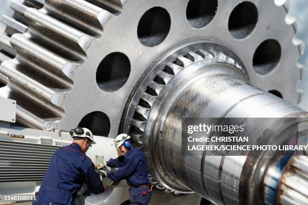 engineering parts and workers - ball bearing stock pictures, royalty-free photos & images