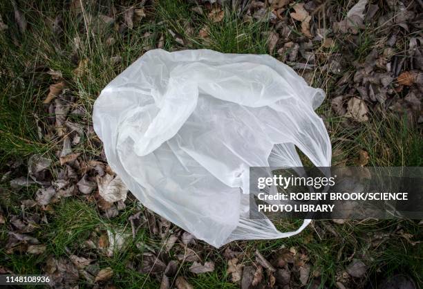 discarded plastic bag - plastic bag stock pictures, royalty-free photos & images