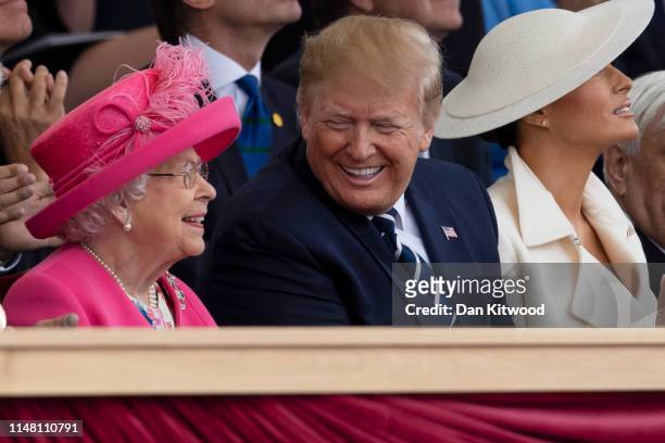 President of the United States, Donald Trump and First Lady of the United States, Melania Trump sit with Queen Elizabeth II as they attend the D-Day...